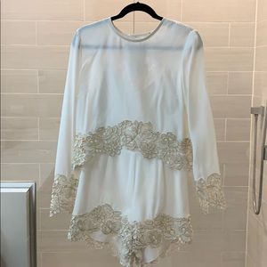 White with gold lace romper by Saylor